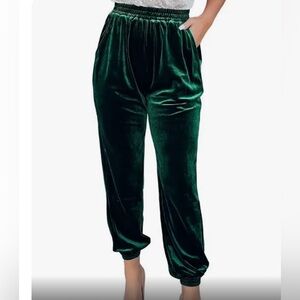 Women’s dark green velvet trousers with a loose straight leg jogger fit